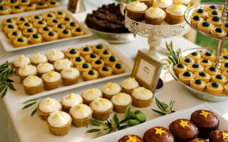 Elegant wedding dessert table featuring affordable yet stylish sweet treats, beautifully arranged to match a romantic wedding theme.