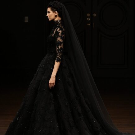Bride wearing a stunning black wedding dress, styled with elegant accessories for a unique and modern bridal look.