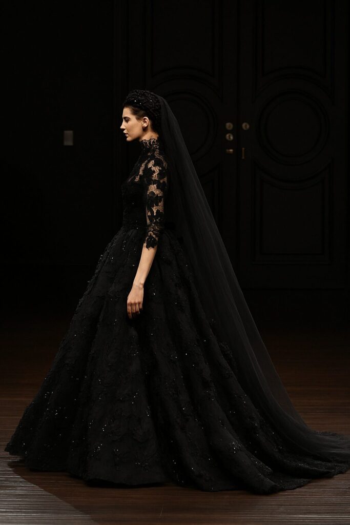 Bride wearing a stunning black wedding dress, styled with elegant accessories for a unique and modern bridal look.
